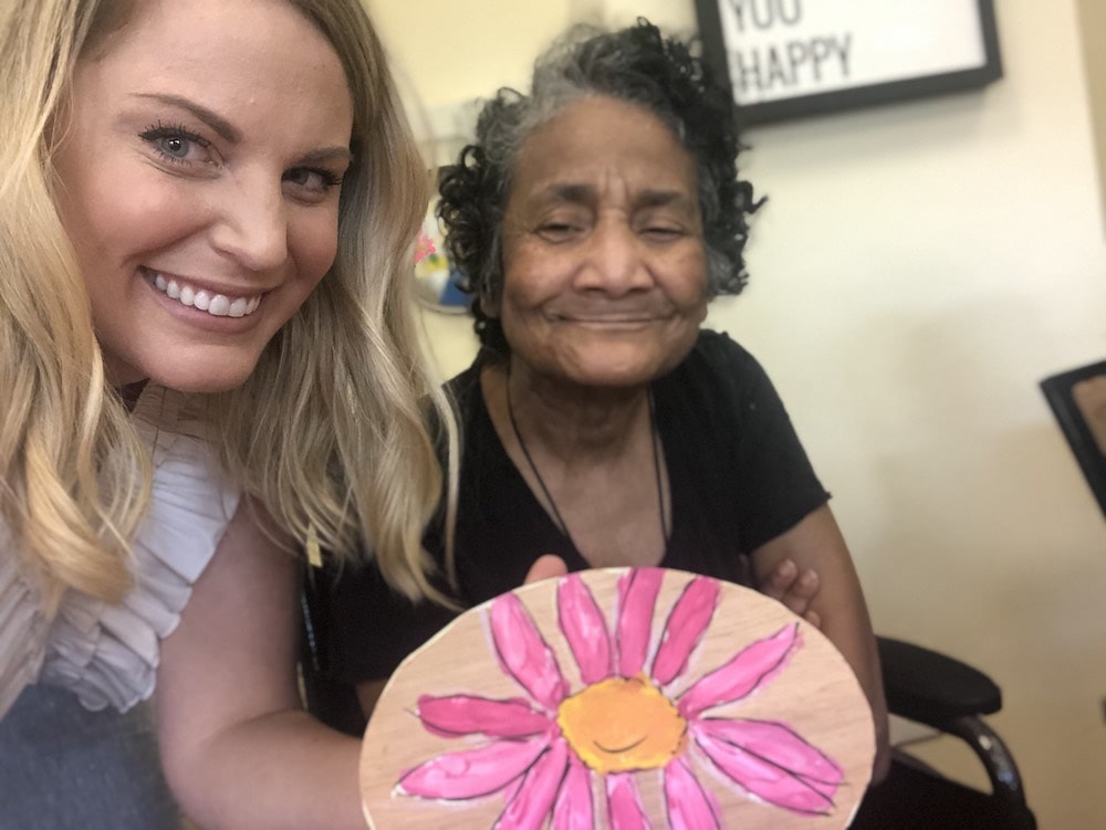 Smiling Senior wih Woman and Holding Flower Art